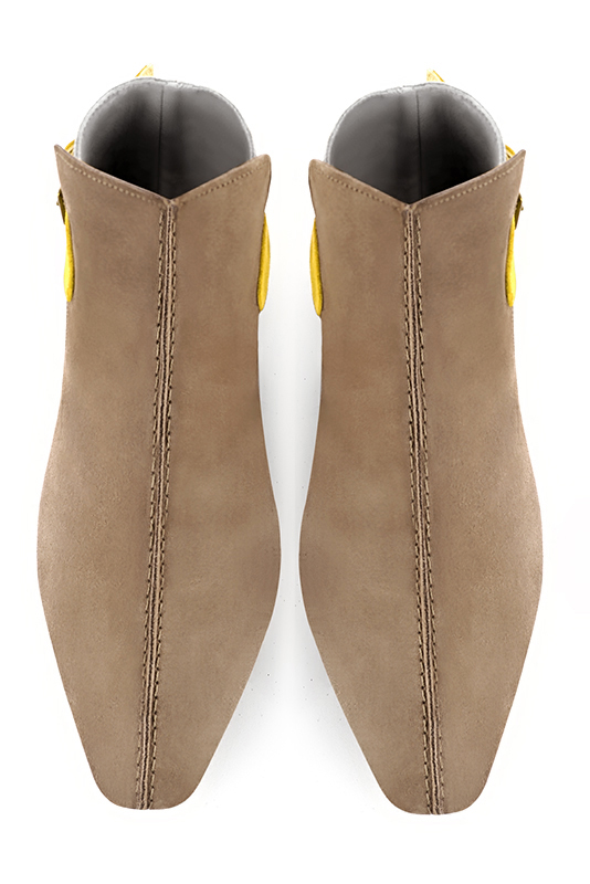 Tan beige, gold and yellow women's ankle boots with buckles at the back. Square toe. Flat flare heels. Top view - Florence KOOIJMAN